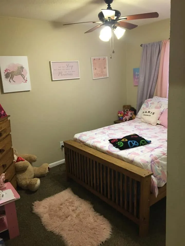 Tidy children's bedroom with bed made and floor clean